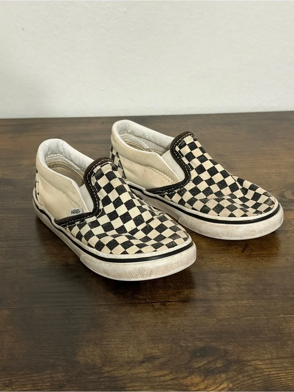 Vans Kids Slip-On Checkerboard Sneakers in Black and Cream